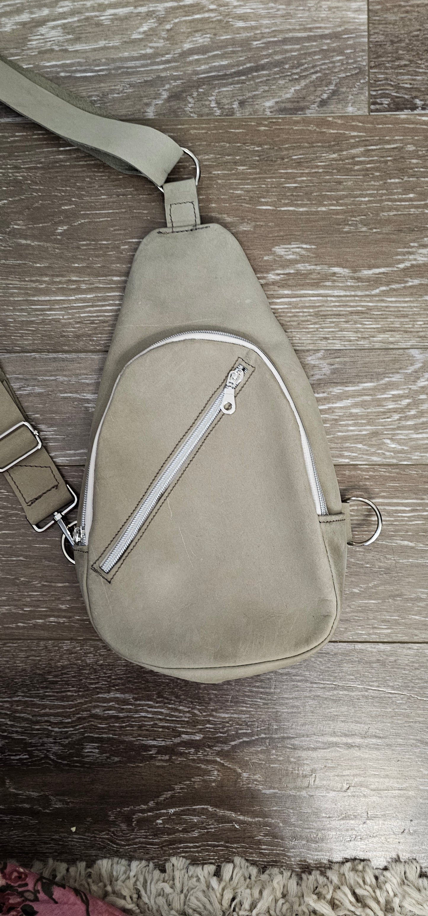 ** sale ** leather sling Moss colored. slanted front zipper