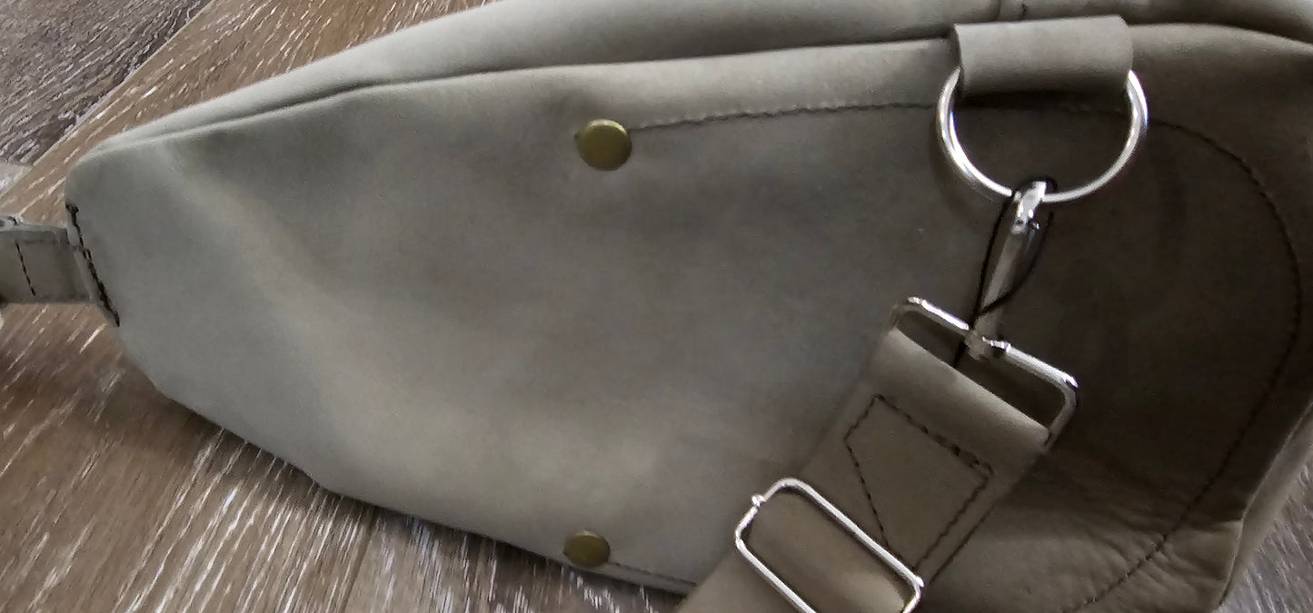 ** sale ** leather sling Moss colored. slanted front zipper