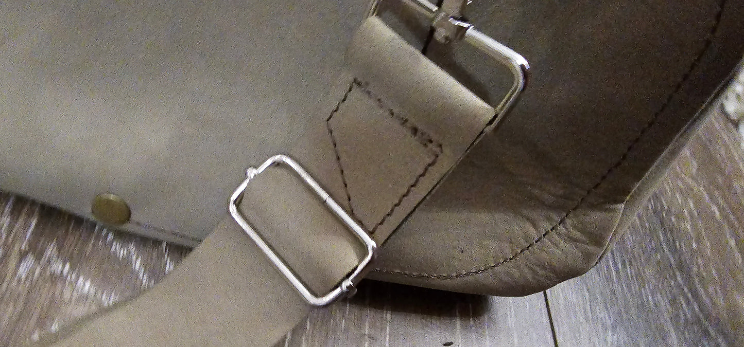 ** sale ** leather sling Moss colored. slanted front zipper