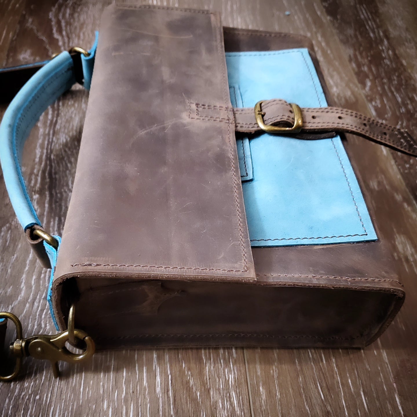 Alaska Dark Horse Crossbody Bag Buckle closure