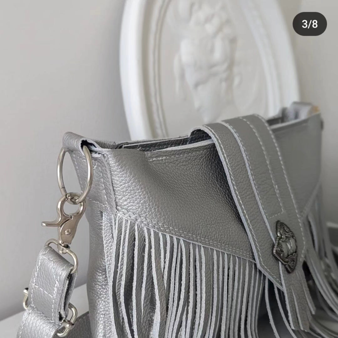 Silver tasseled bag with concho