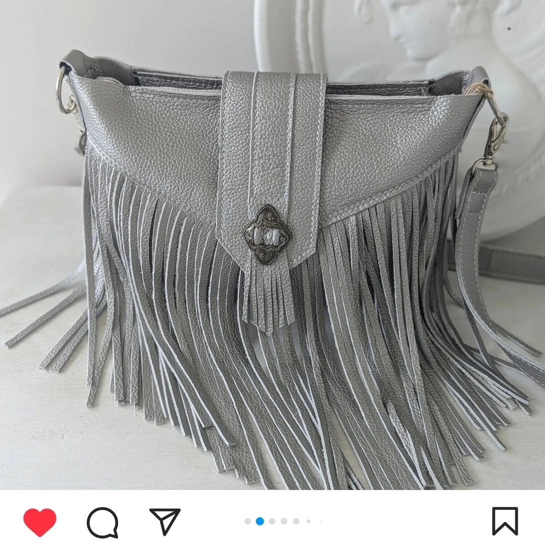 Silver tasseled bag with concho