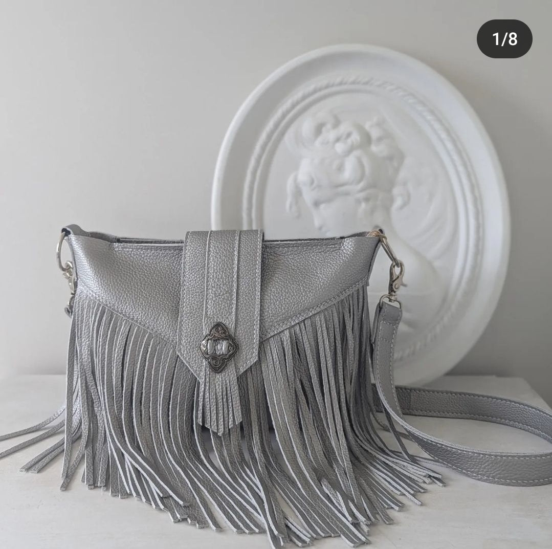 Silver tasseled bag with concho