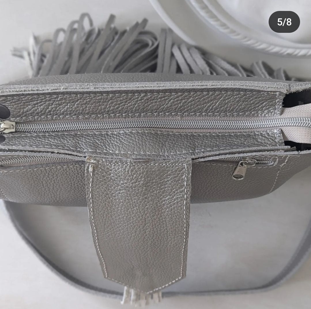 Silver tasseled bag with concho